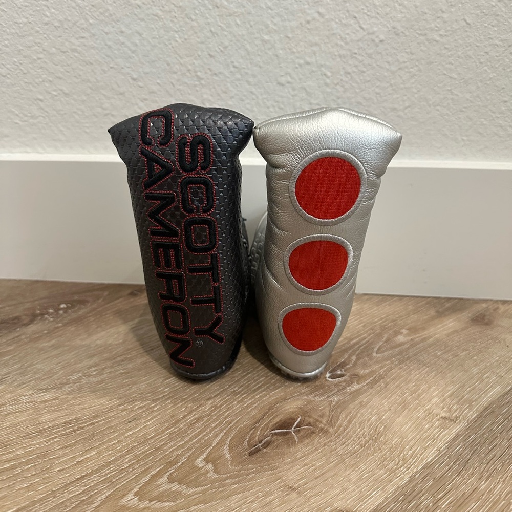 Two Scotty Cameron head covers Black and Silver Blade style.